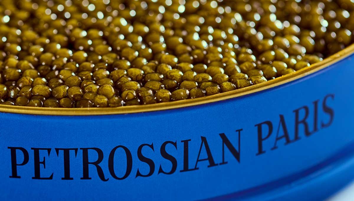 Golden caviar in a blue Petrossian Paris tin
