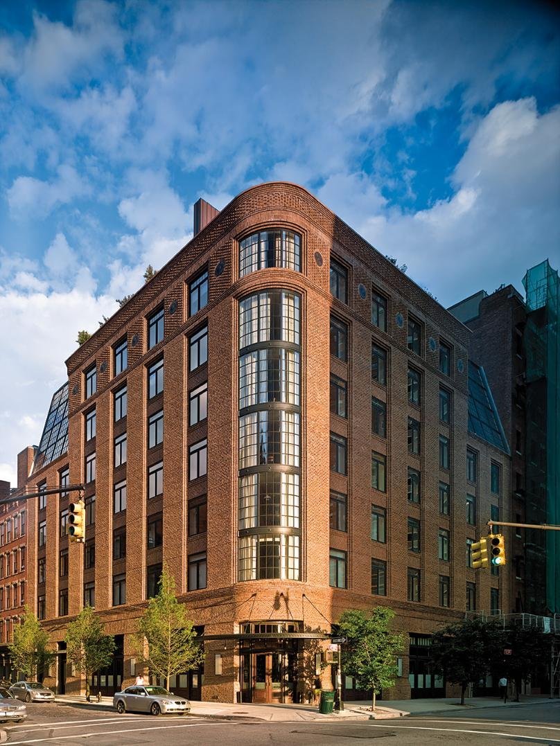 The brick exterior of The Greenwich Hotel in Tribeca, New York.