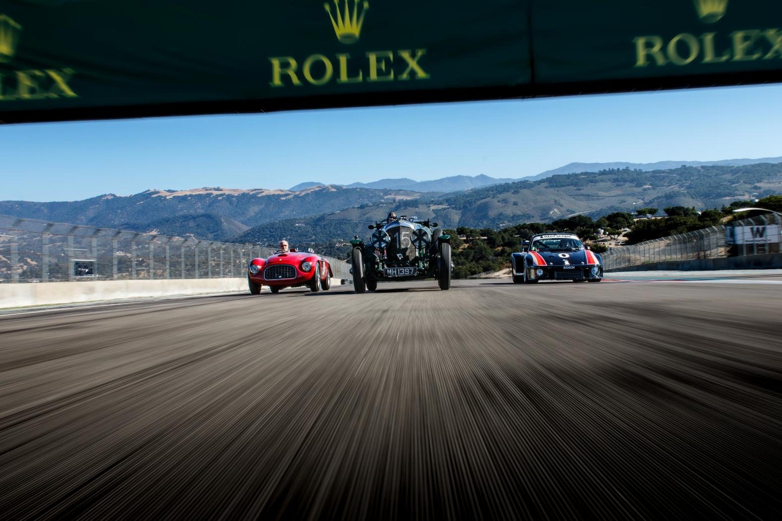 Historic racing cars at Laguna Seca during the Rolex Monterey Motorsports Reunion