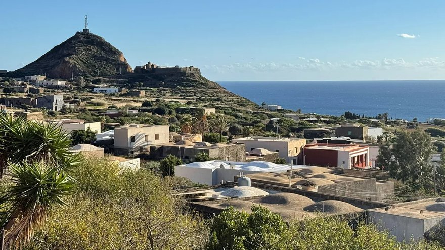 Lava-stone dammusi and terraced gardens on the island of Pantelleria