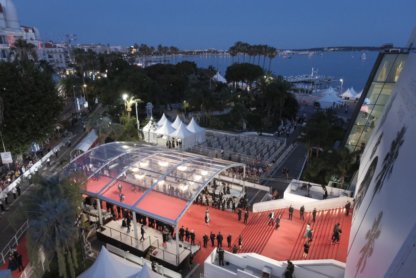 The red carpet and steps of the Palais des Festivals in Cannes seen from above at dusk