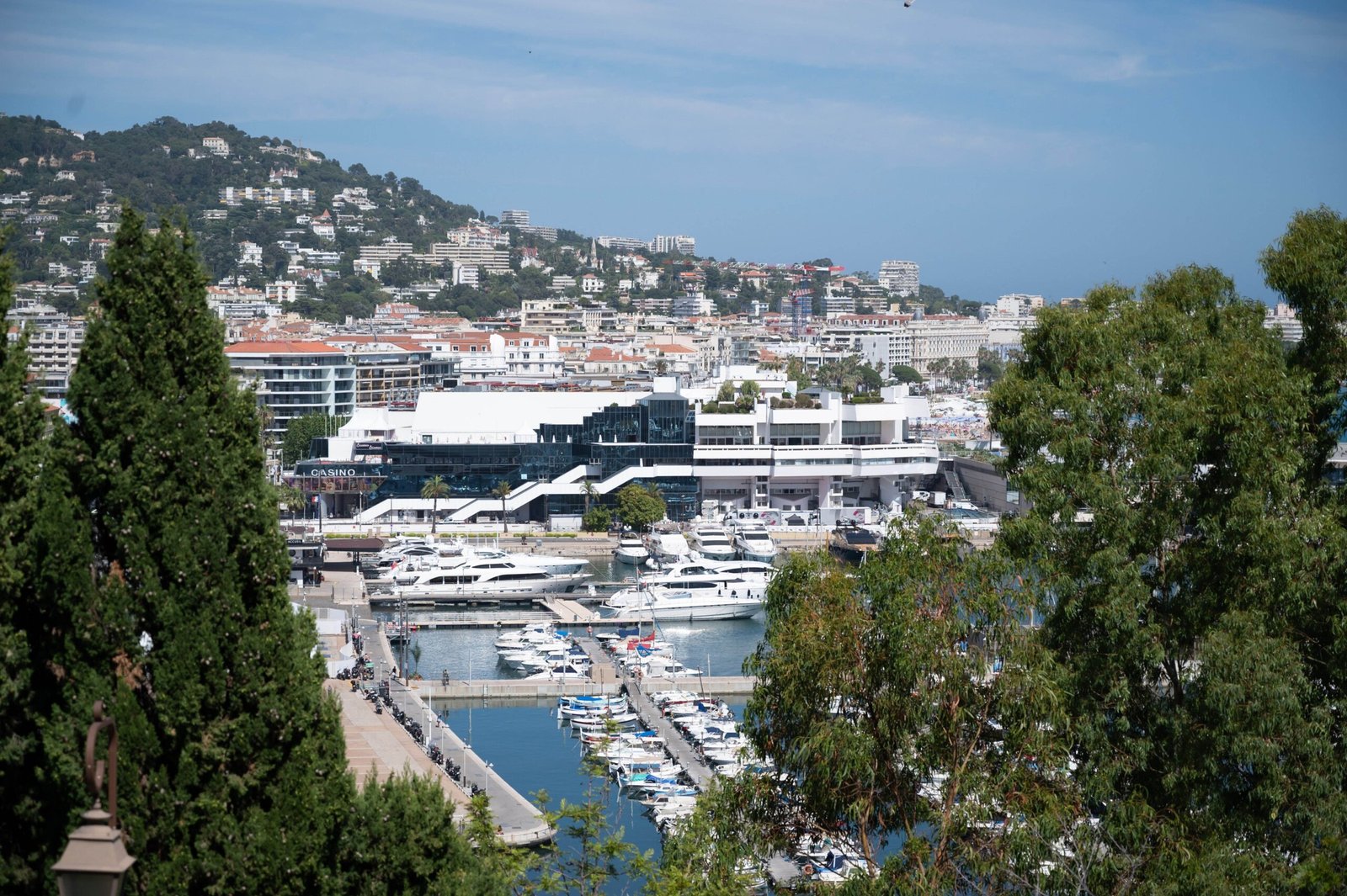 The Palais des Festivals seen from the hills, with the harbour of Cannes and its yachts