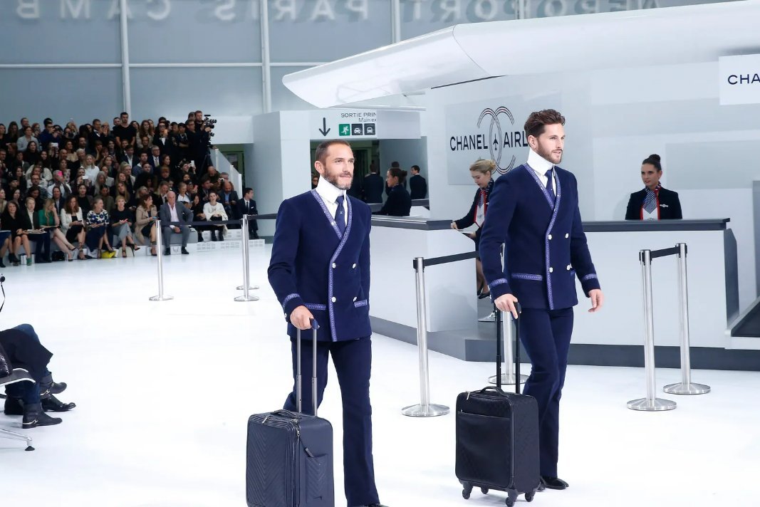 Men wearing Chanel at a fashion event