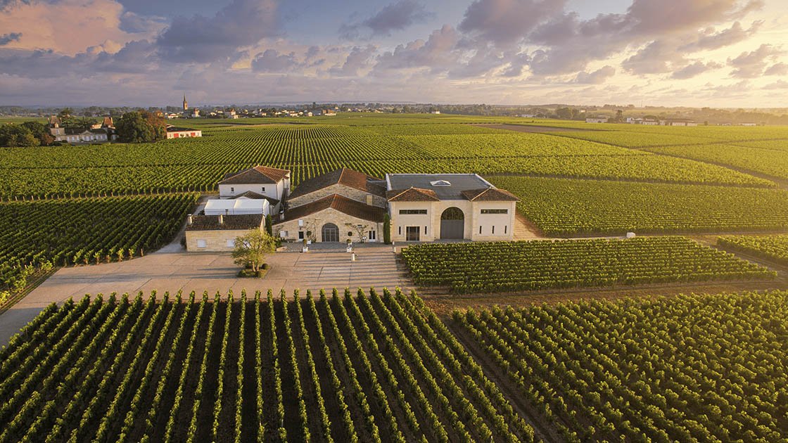 Aerial view of Château La Conseillante surrounded by vineyards in Pomerol
