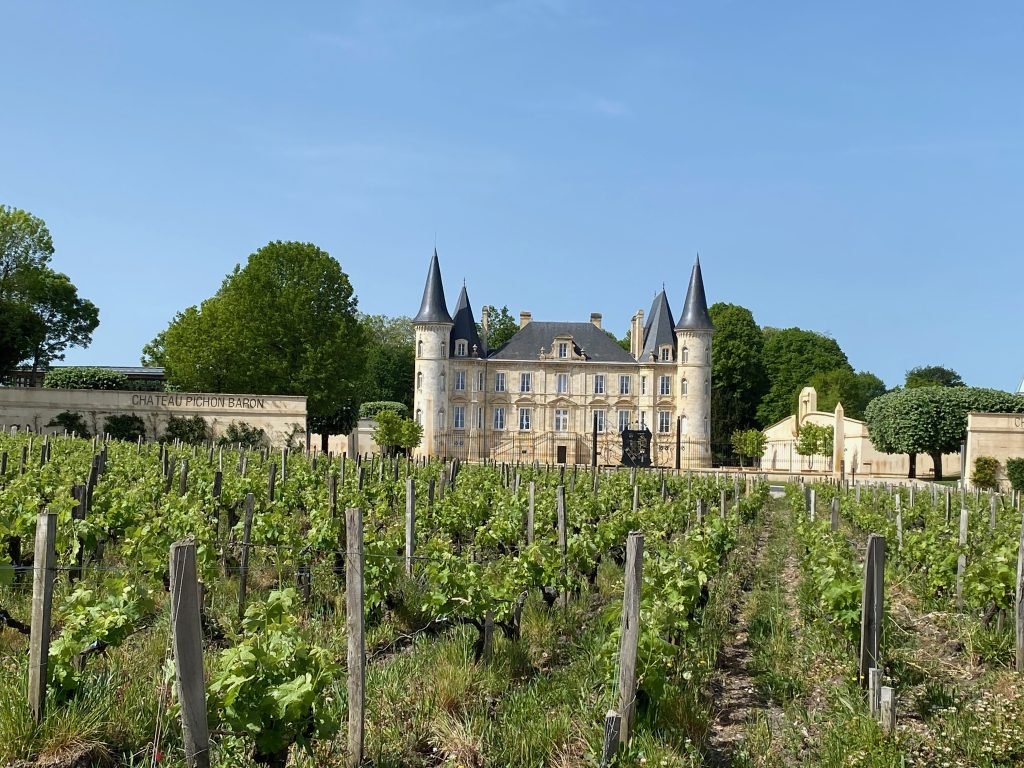 The towers of Château Pichon Baron in Pauillac seen from the vineyard