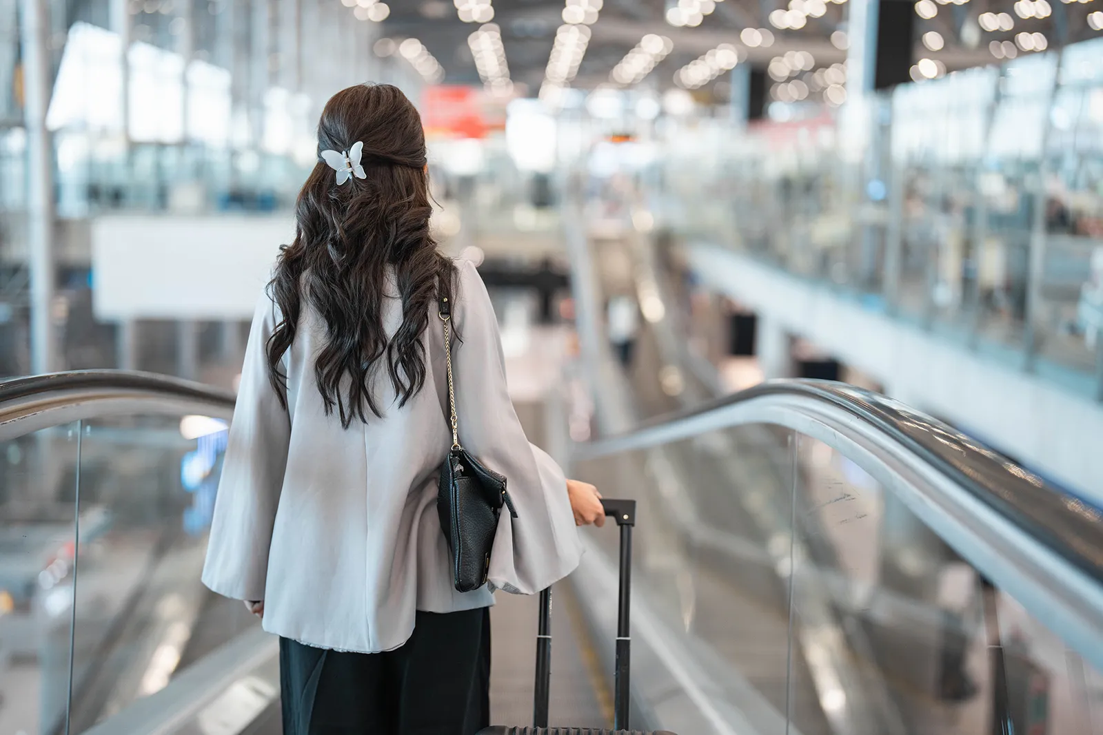 Passengers with hand luggage queueing to board at a European airport