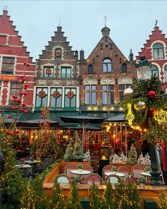 Wooden chalets and lights at a European Christmas market