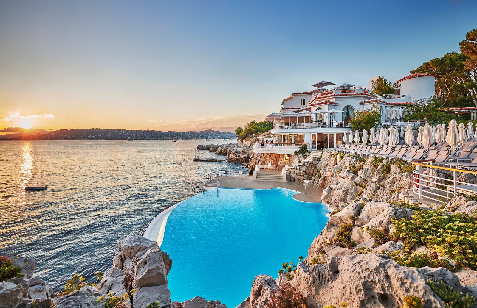 The Eden-Roc pool on the rocks of Cap d'Antibes at sunset