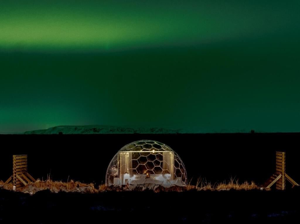 A glass dome under the northern lights at Immersion Iceland