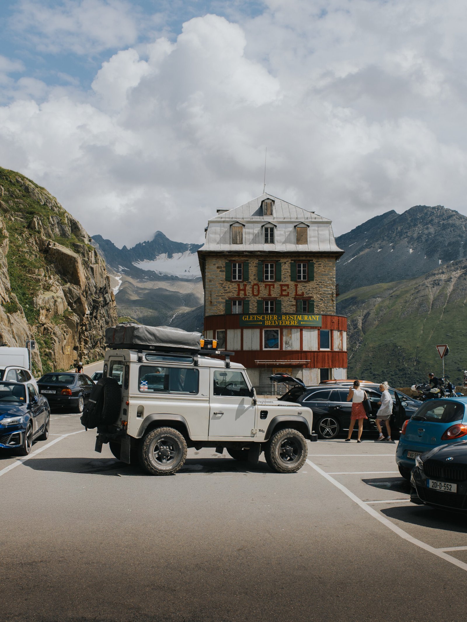 Land Rover Defender parked outside the Hotel-Restaurant Belvédère in Switzerland