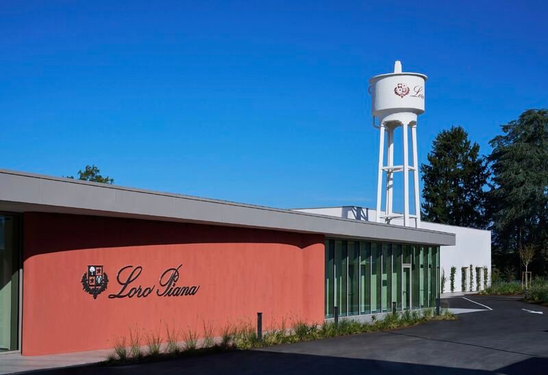 Loro Piana signage and the historic water tower at the Ghemme site