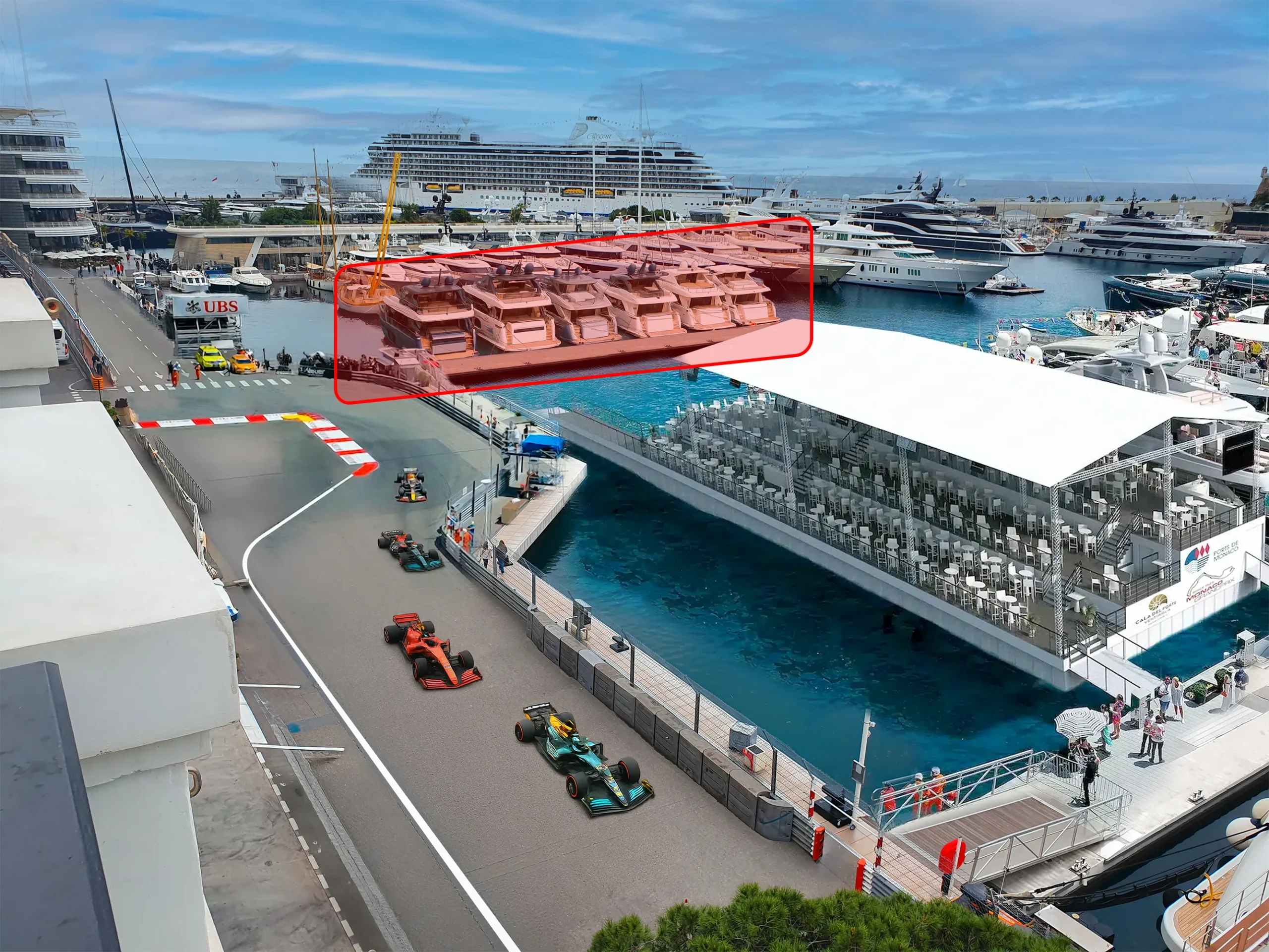 Formula 1 cars through the swimming pool section in Monaco, with a grandstand and yachts behind