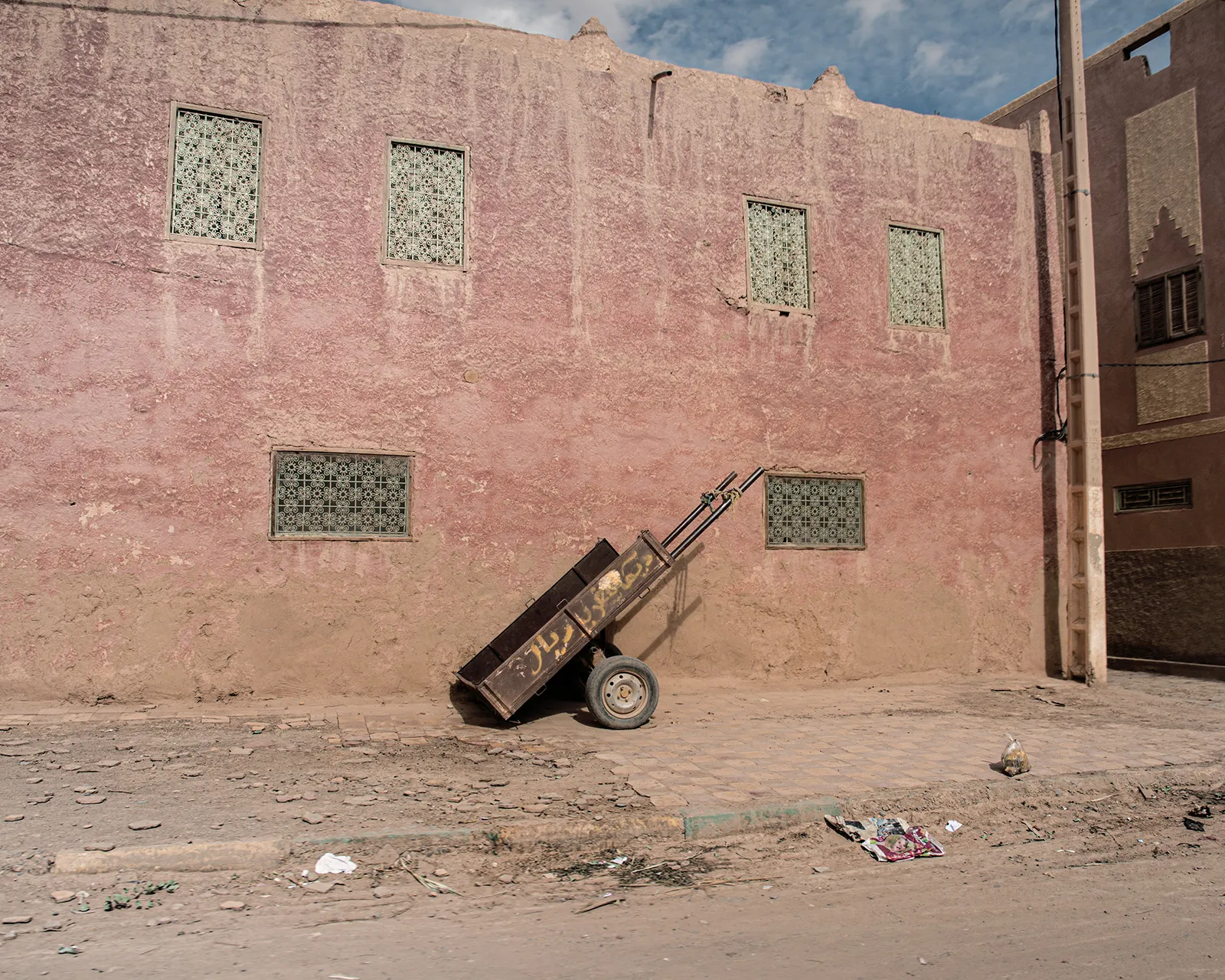 Abandoned wheelbarrow on a street in Erfoud