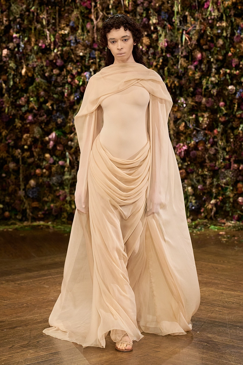 Look from the Maison Margiela Spring/Summer 2027 show against a wall of dried flowers