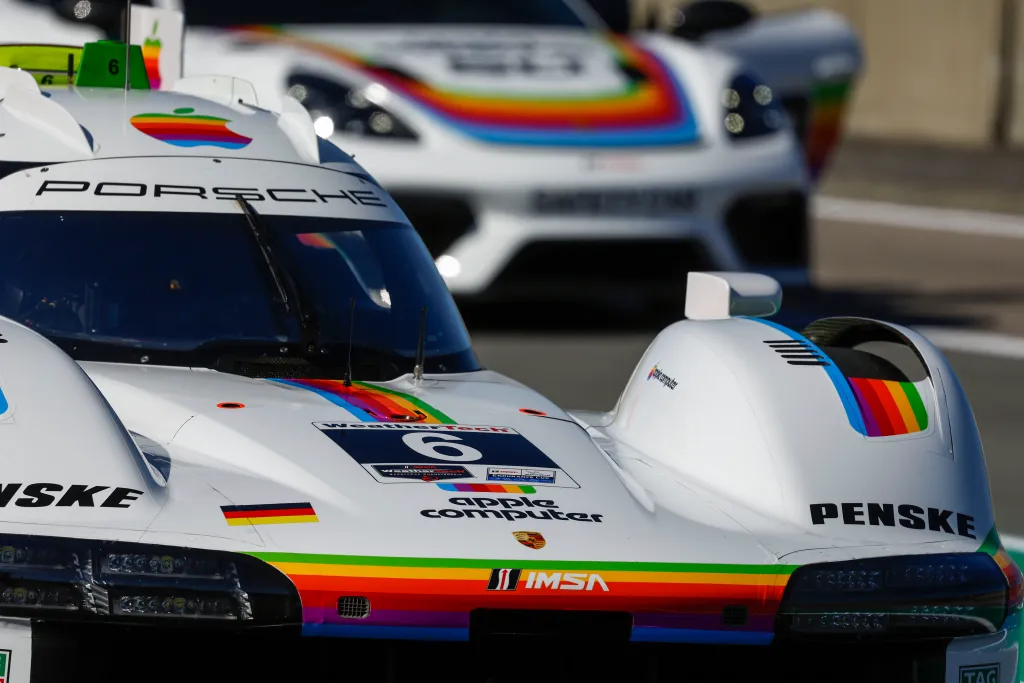 Curved bodywork of the Porsche 963 carrying the rainbow stripes