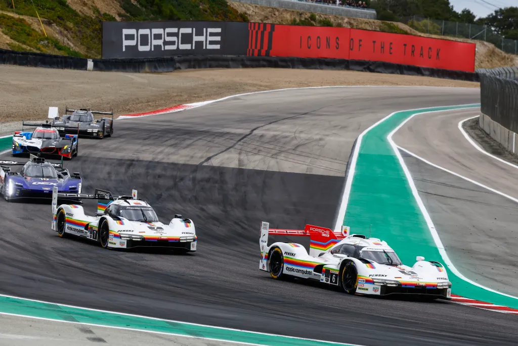 Two Porsche Penske 963s in the Apple Computer livery at Laguna Seca