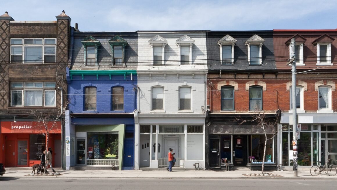 Shopfronts and streetcar tracks on Queen Street West, Toronto