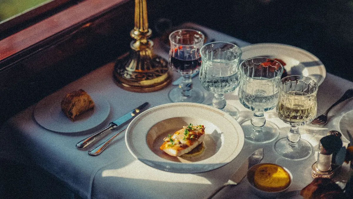 Table set with plate and wine glass aboard the Venice Simplon-Orient-Express