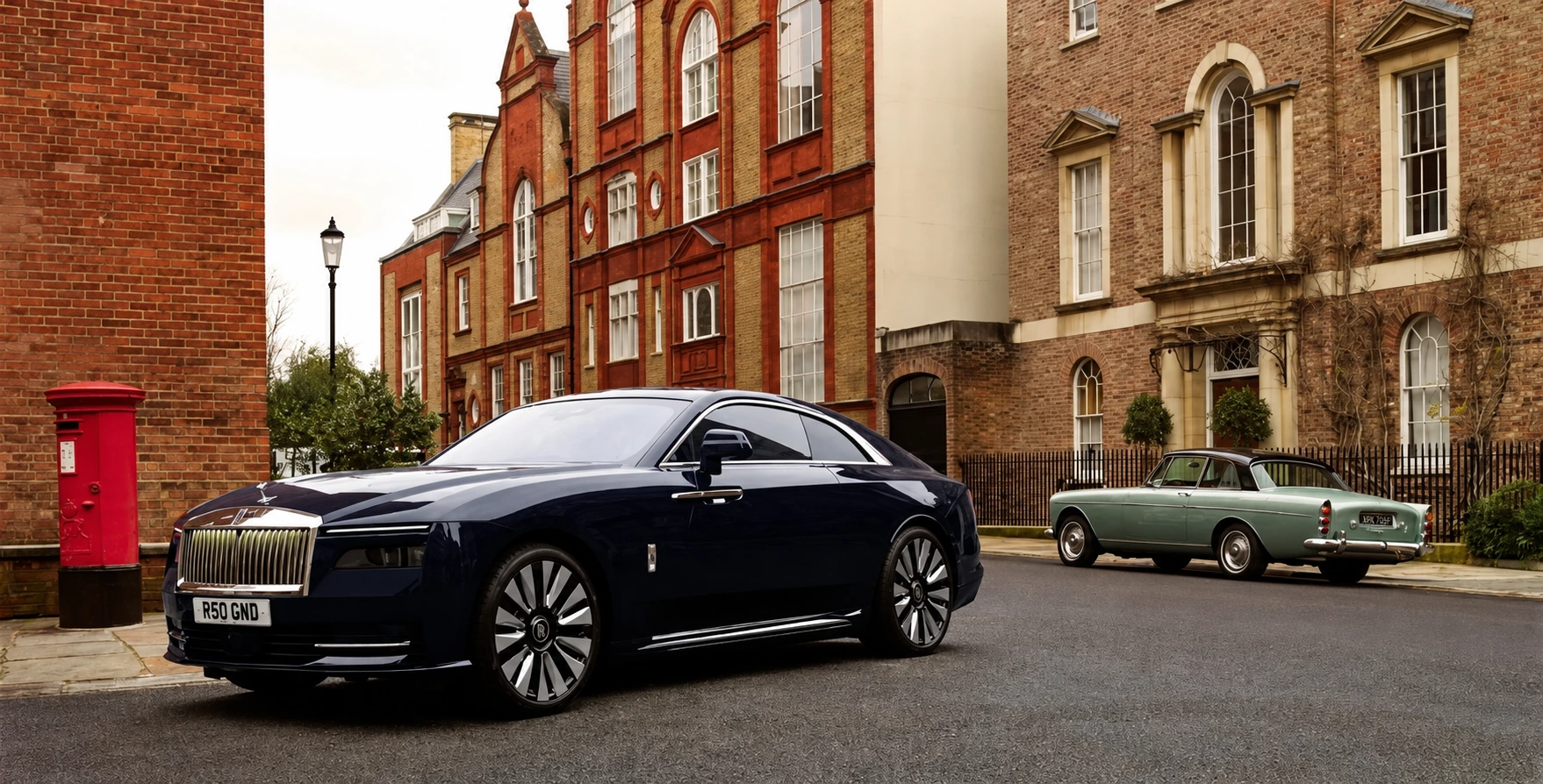 Rolls-Royce Spectre beside a 1965 Rolls-Royce Silver Cloud coupé in London